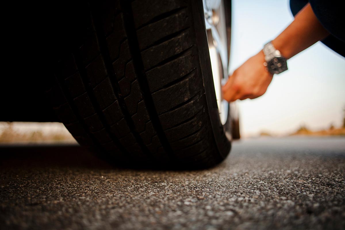 Man Checking Wheel.