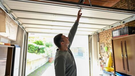 Image of man organizing garage.