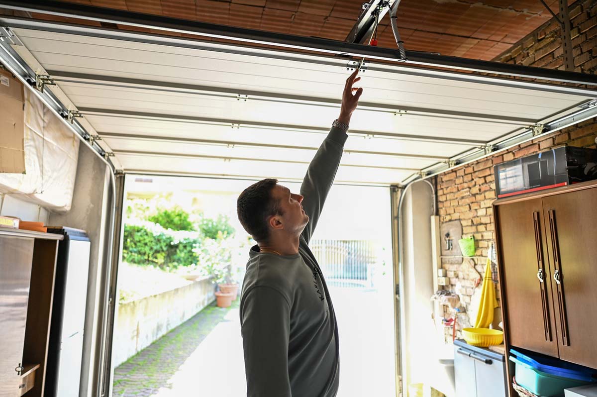 Image of man organizing garage.