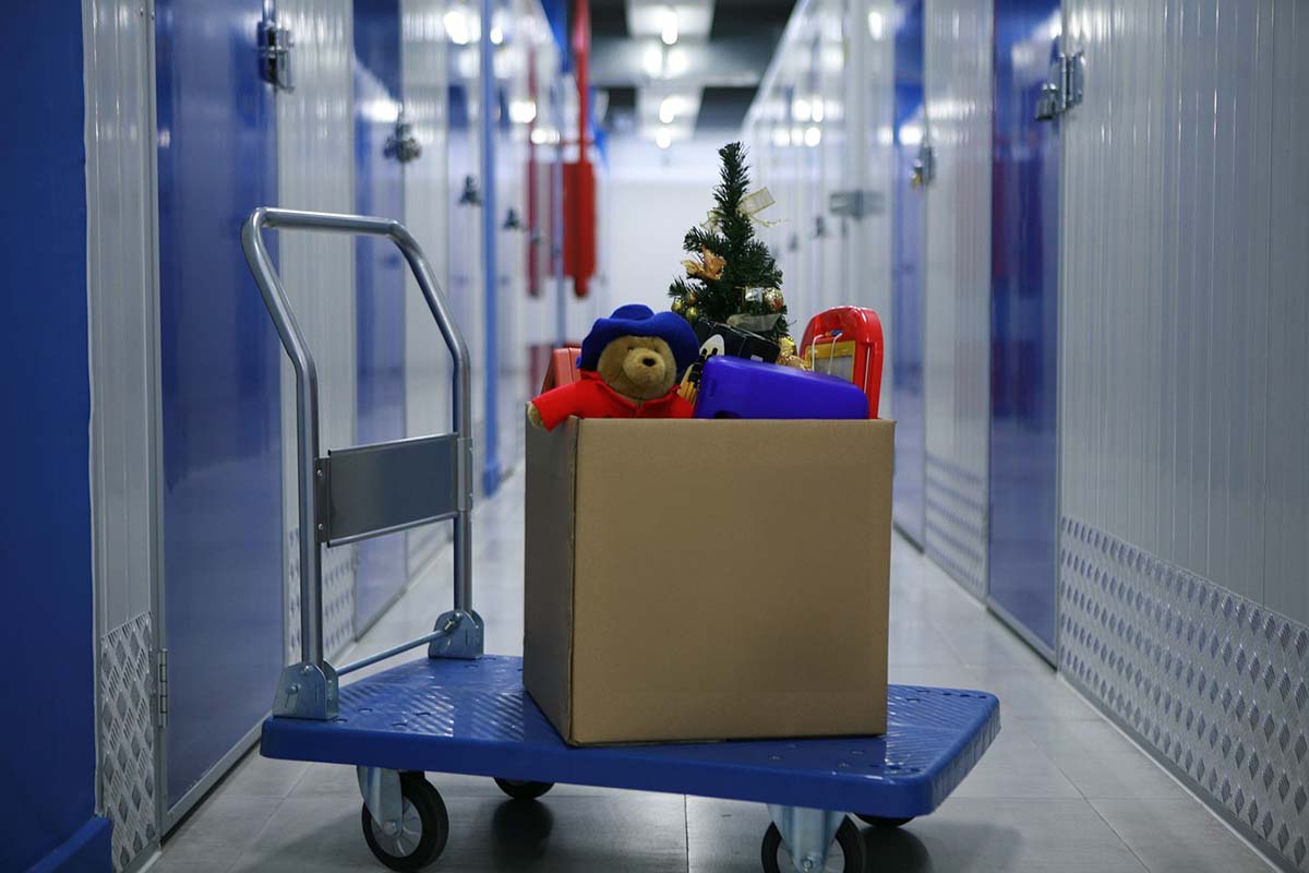 taking the seasonal items to a storage unit after the holidays.